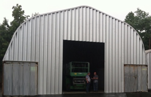 Quonset hut attached to containers